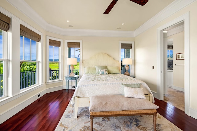 bedroom featuring wood-type flooring, multiple windows, and ceiling fan