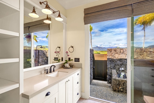 bathroom featuring a mountain view and vanity