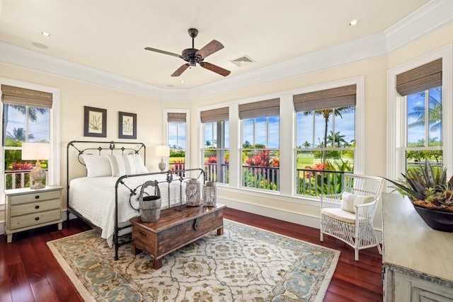 bedroom featuring ceiling fan, dark hardwood / wood-style flooring, crown molding, and multiple windows