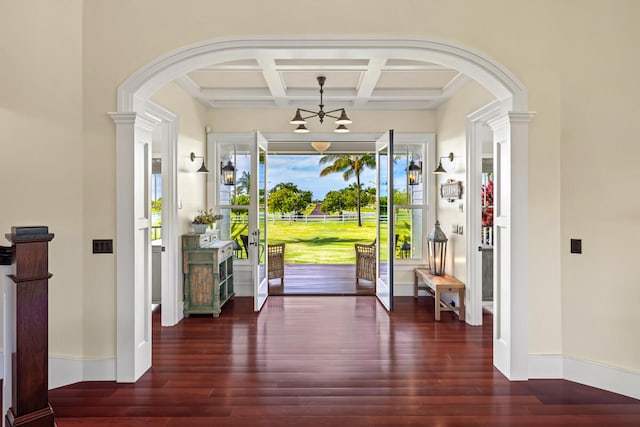 foyer with beamed ceiling, dark wood-type flooring, and coffered ceiling