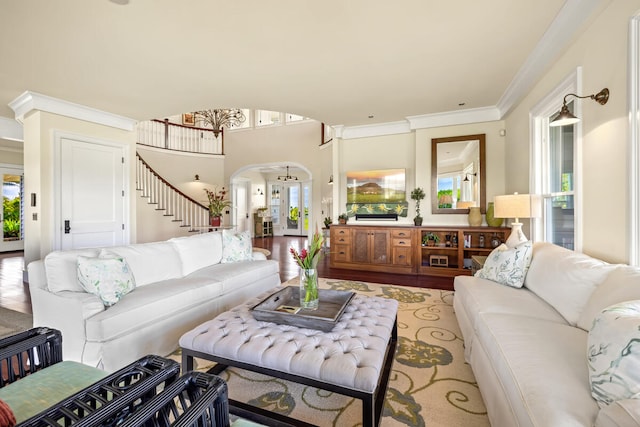 living room with ornamental molding and hardwood / wood-style flooring