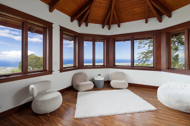 sunroom / solarium featuring lofted ceiling with beams, a water view, and wooden ceiling