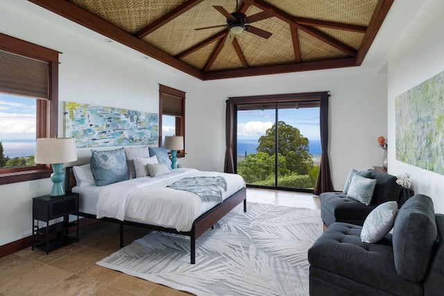 bedroom featuring ceiling fan, vaulted ceiling, access to exterior, and multiple windows