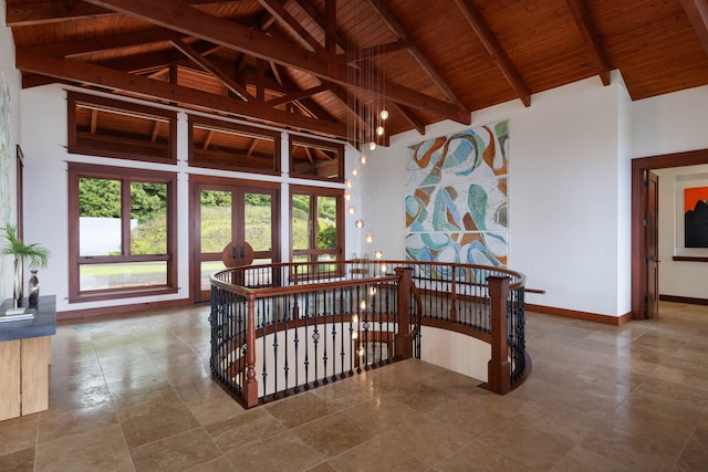 interior space with beam ceiling, high vaulted ceiling, and wood ceiling