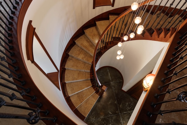 stairway with tile patterned flooring