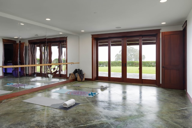 empty room with concrete flooring and french doors