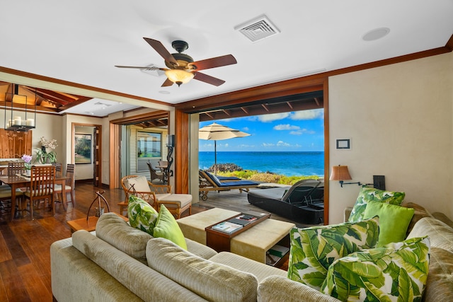 living room with hardwood / wood-style floors, ceiling fan, and a water view