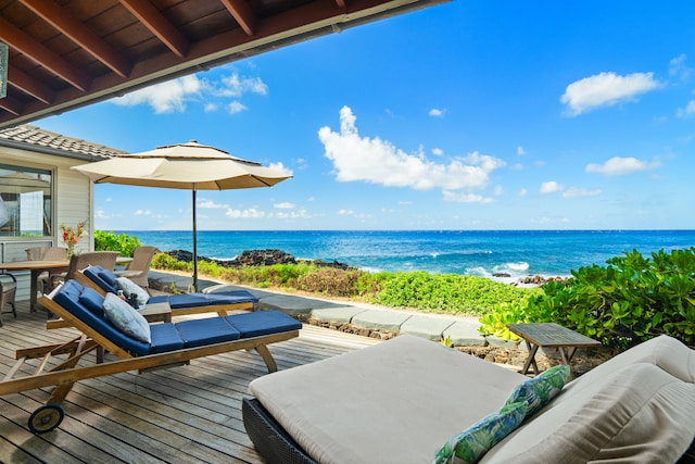 deck featuring outdoor lounge area and a water view