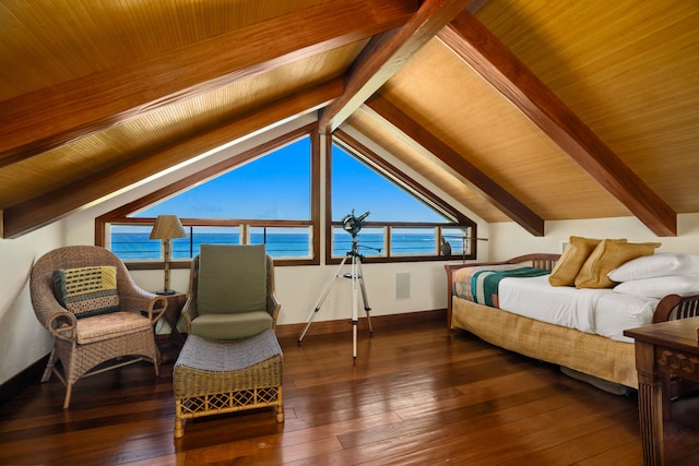 bedroom featuring lofted ceiling with beams and hardwood / wood-style flooring