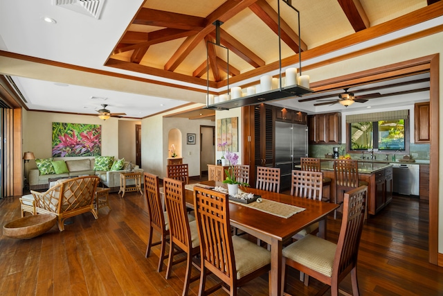 dining space with dark hardwood / wood-style flooring, vaulted ceiling, and ceiling fan