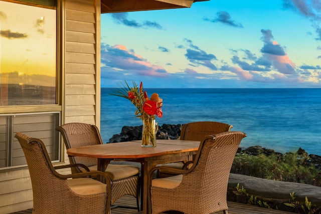 balcony at dusk with a water view