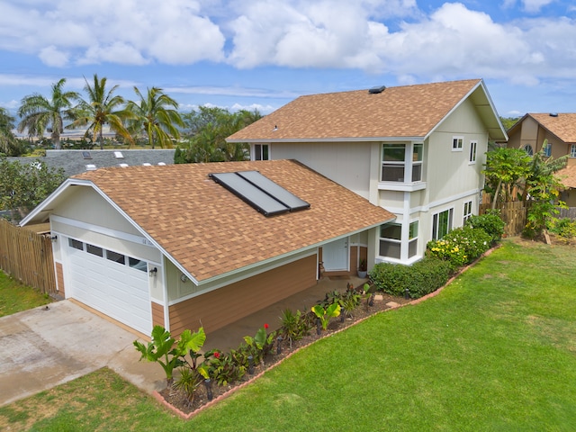 exterior space with a lawn and a garage