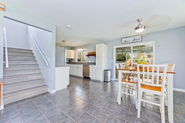 unfurnished dining area featuring ceiling fan