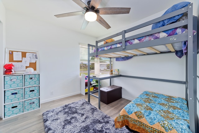 bedroom with light wood-type flooring and ceiling fan