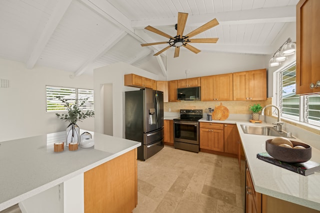 kitchen with lofted ceiling with beams, ceiling fan, stainless steel appliances, and sink