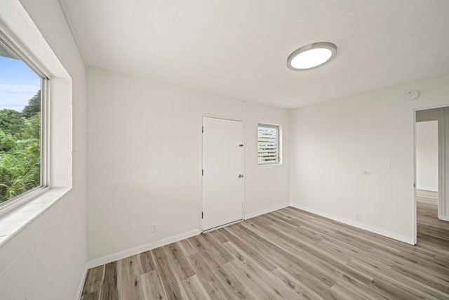 unfurnished room featuring hardwood / wood-style floors