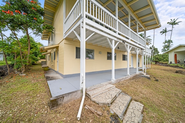 view of side of home featuring a patio area