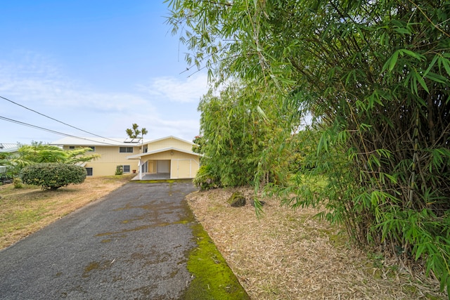 obstructed view of property featuring a garage