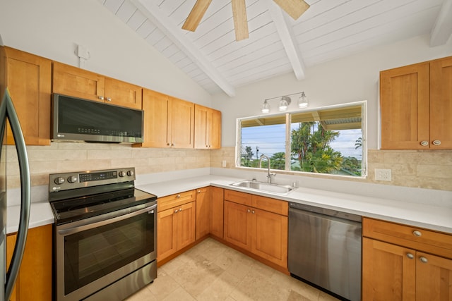 kitchen with tasteful backsplash, stainless steel appliances, sink, ceiling fan, and vaulted ceiling with beams