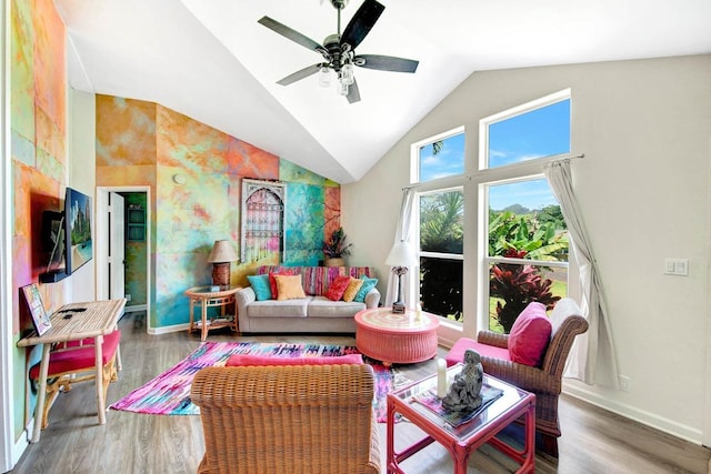 living room with ceiling fan, wood finished floors, and baseboards