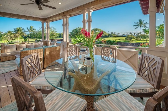 wooden deck with ceiling fan and an outdoor hangout area