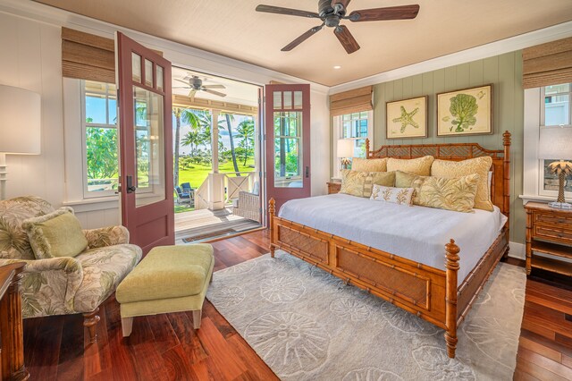 bedroom featuring ceiling fan, multiple windows, access to outside, and wood-type flooring