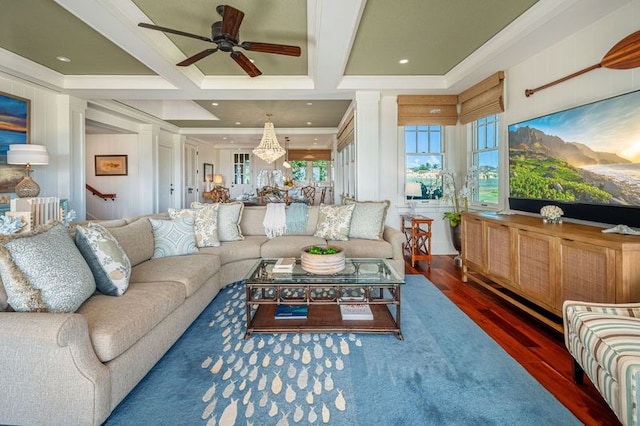 living room featuring ceiling fan, dark hardwood / wood-style floors, coffered ceiling, beamed ceiling, and crown molding