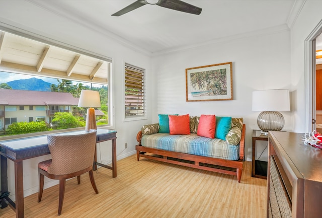 sitting room featuring ceiling fan, ornamental molding, vaulted ceiling with beams, and light hardwood / wood-style flooring