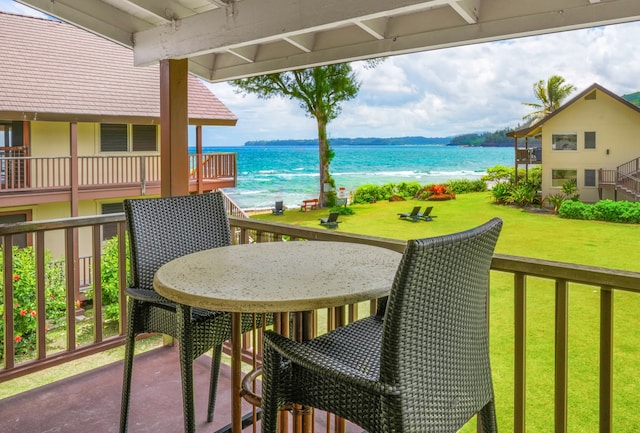 balcony featuring a water view