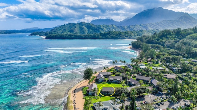 aerial view with a view of the beach and a water and mountain view