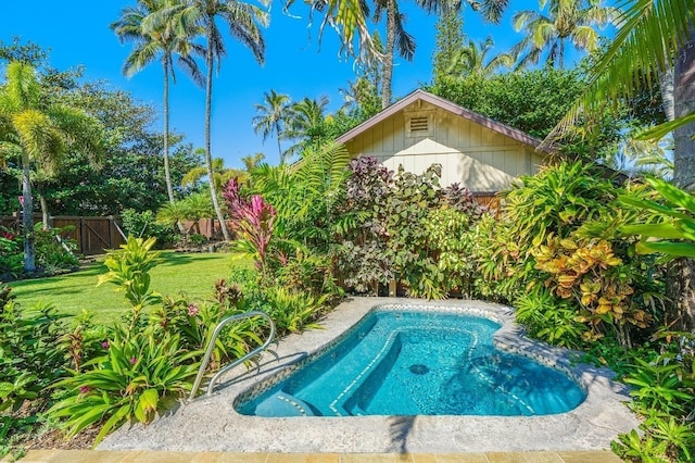 view of pool with a yard