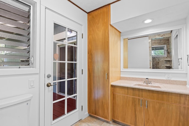 bathroom with vanity and toilet