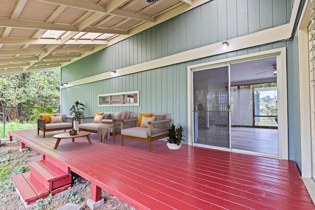 wooden terrace featuring outdoor lounge area