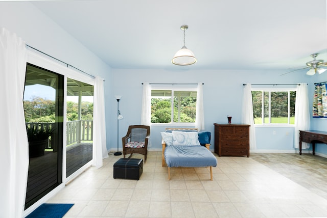 sitting room featuring ceiling fan and a wealth of natural light