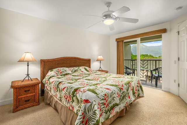 carpeted bedroom featuring access to exterior and ceiling fan