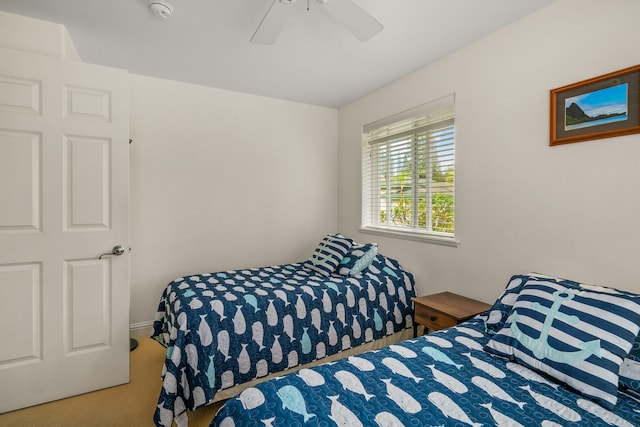 bedroom with ceiling fan and carpet floors