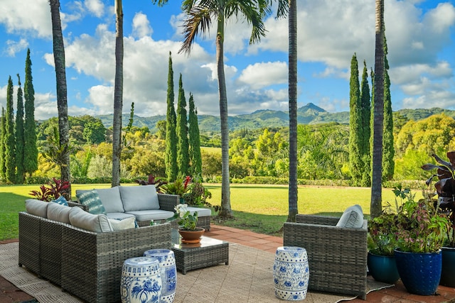 view of patio with a mountain view and outdoor lounge area