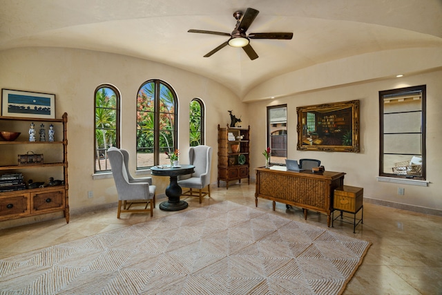 home office featuring lofted ceiling, baseboards, and ceiling fan
