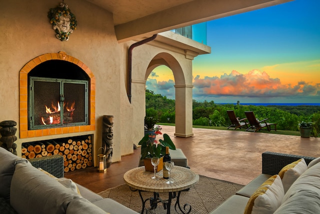 view of patio terrace at dusk