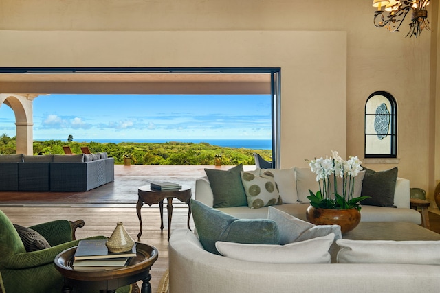 interior space featuring a water view, a chandelier, and hardwood / wood-style flooring