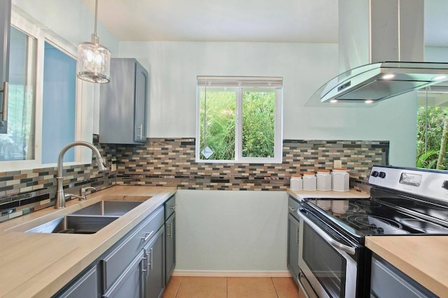 kitchen with island range hood, sink, stainless steel electric range, and gray cabinets