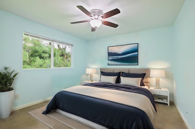 carpeted bedroom featuring ceiling fan