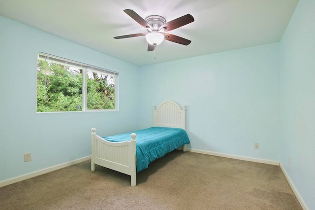 bedroom featuring ceiling fan and carpet floors