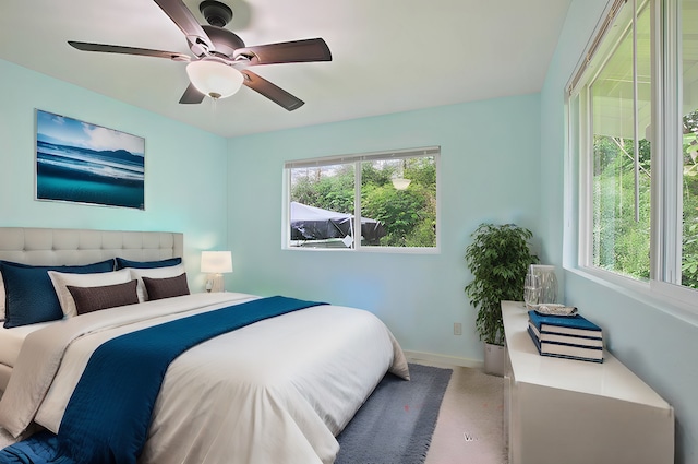 bedroom with ceiling fan and carpet