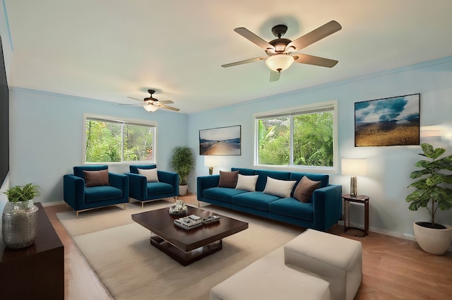 living room featuring crown molding, wood-type flooring, and ceiling fan