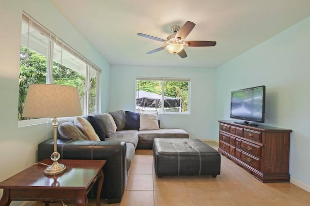 living room with light tile patterned floors and ceiling fan