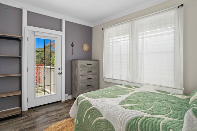 bedroom with crown molding, access to outside, and dark hardwood / wood-style floors