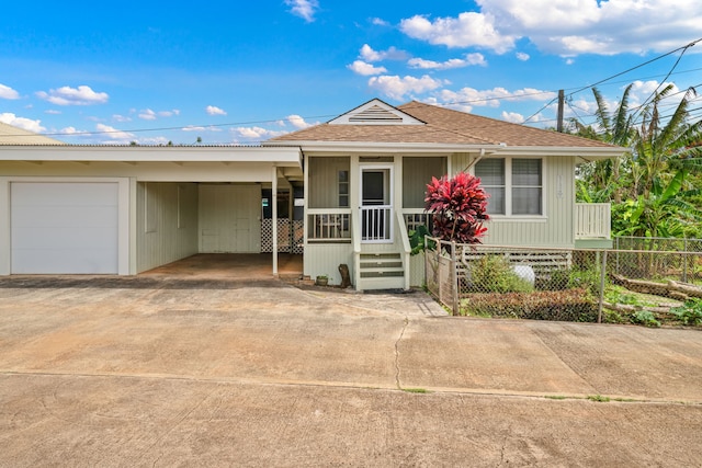 single story home with a carport and a garage