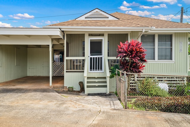 view of front facade with a carport