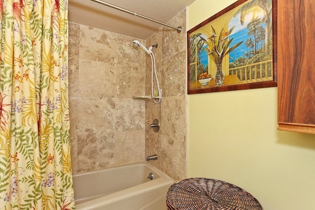 bathroom featuring a textured ceiling and shower / bath combo